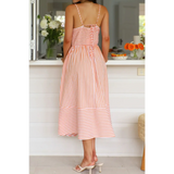 Trendsi striped beach midi dress with spaghetti straps and back tie detail on woman indoors