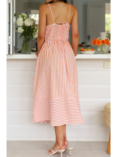 Trendsi striped beach midi dress with spaghetti straps and back tie detail on woman indoors