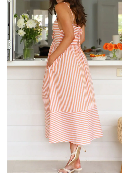 Trendsi striped beach midi dress with pockets and adjustable straps worn by woman indoors