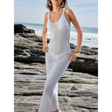 Delicate Sheer Swimsuit Cover Up by Babe Beachwear worn on rocky beach with ocean background
