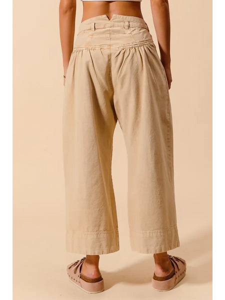 Beige chic wide leg trousers for women by Babe Beachwaer shown from the back with gathered waist detail