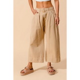 Beige chic wide leg trousers for women by Babe Beachwear styled with platform sandals