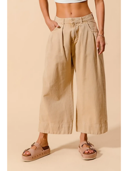 Beige chic wide leg trousers for women by Babe Beachwear styled with platform sandals