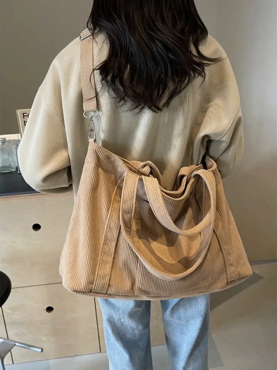 Babe Beachwaer lightweight Ladies duffle bag in beige corduroy fabric worn over shoulder