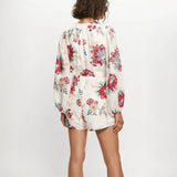 Babe Beachwear belted floral summer romper with long sleeves and colorful flower print back side view