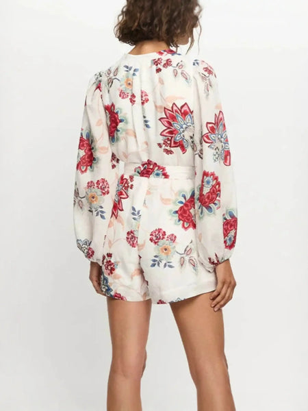 Babe Beachwear belted floral summer romper with long sleeves and colorful flower print back side view