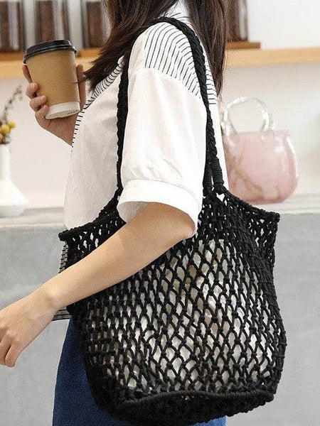 Miss Sparkling black braided net beach tote carried by woman with coffee cup in hand