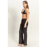 Trendsi black crochet bikini cover up pants set worn by woman with halter top and wide-leg crochet pants