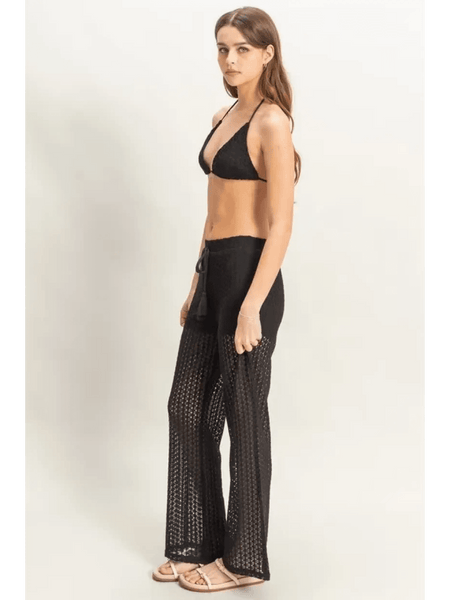 Trendsi black crochet bikini cover up pants set worn by woman with halter top and wide-leg crochet pants