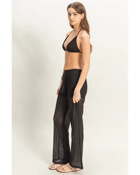 Trendsi black crochet bikini cover up pants set worn by woman with halter top and wide-leg crochet pants