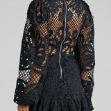 Babe Beachwear black lace mini dress with intricate floral design and zipper back detailing