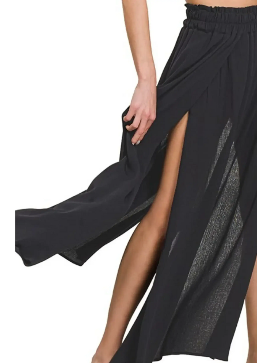 Trendsi black maxi skirt for resort wear featuring high side slit and flowy lightweight fabric