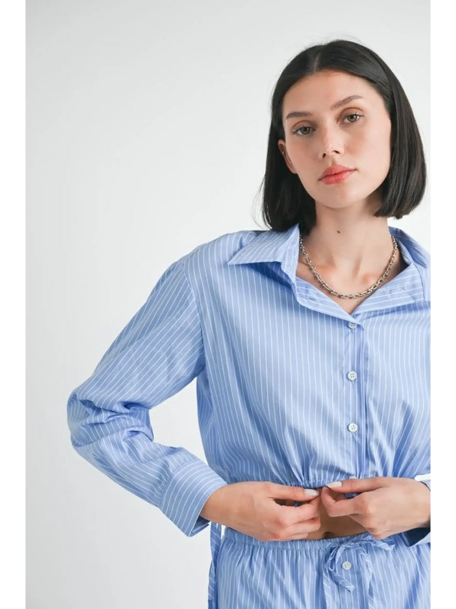 Emory Park blue and white cotton beach top worn by model with long sleeves and button front