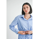 Emory Park blue and white cotton beach top worn by model with long sleeves and button front