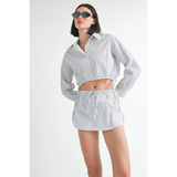 Emory Park blue and white cotton beach top with long sleeves and collar worn with matching shorts 