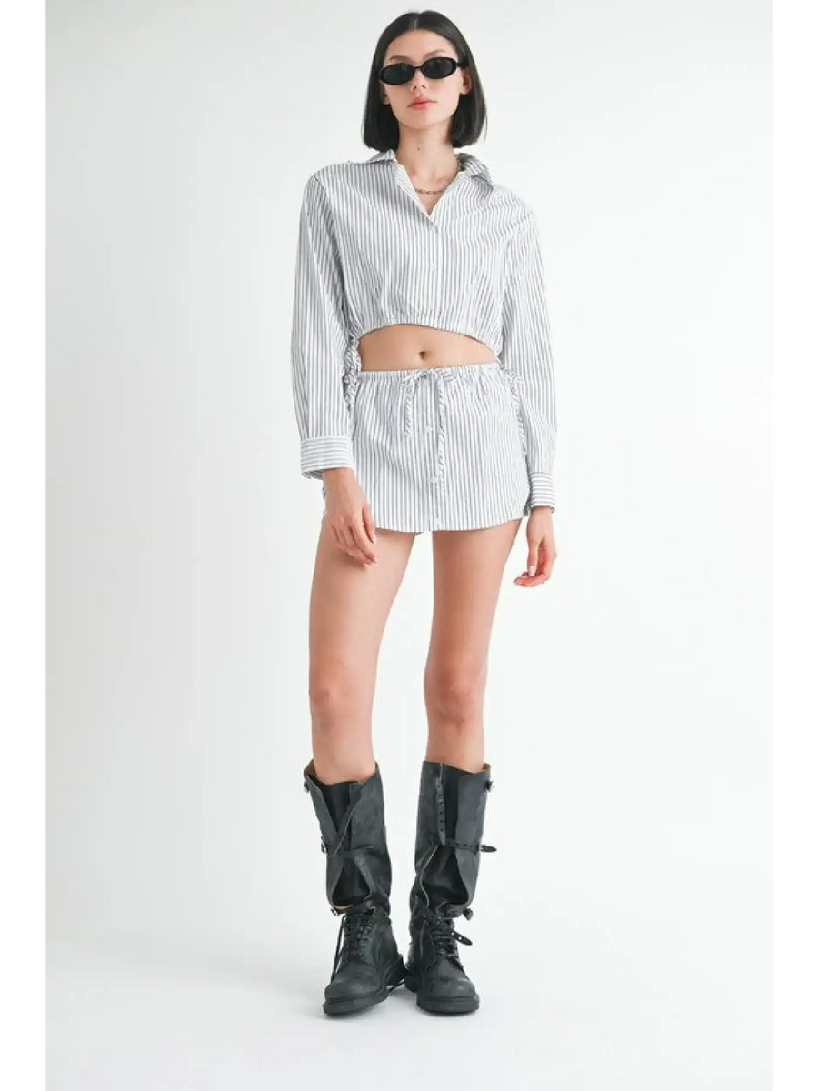 Emory Park blue and white cotton beach top with long sleeves styled with matching shorts and black boots
