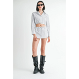 Emory Park blue and white cotton beach top with long sleeves styled with matching shorts and black boots