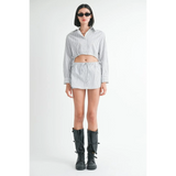 Emory Park blue and white cotton beach top with long sleeves worn by model with black boots and sunglasses