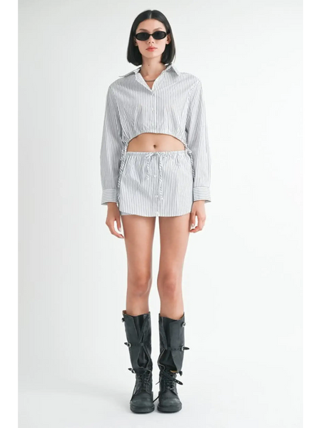 Emory Park blue and white cotton beach top with long sleeves worn by model with black boots and sunglasses
