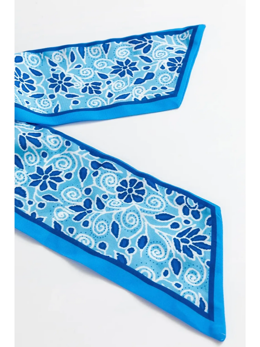 Close-up of blue floral pattern fabric detail for blue floral maxi dress affordable by Trendsi