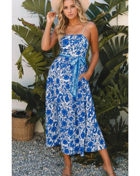 lady wearing a maxi dress affordable by Trendsi midi dress with spaghetti straps and waist tie
