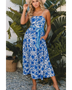 woman wearing a blue floral maxi dress affordable sleeveless midi dress with waist tie and pockets