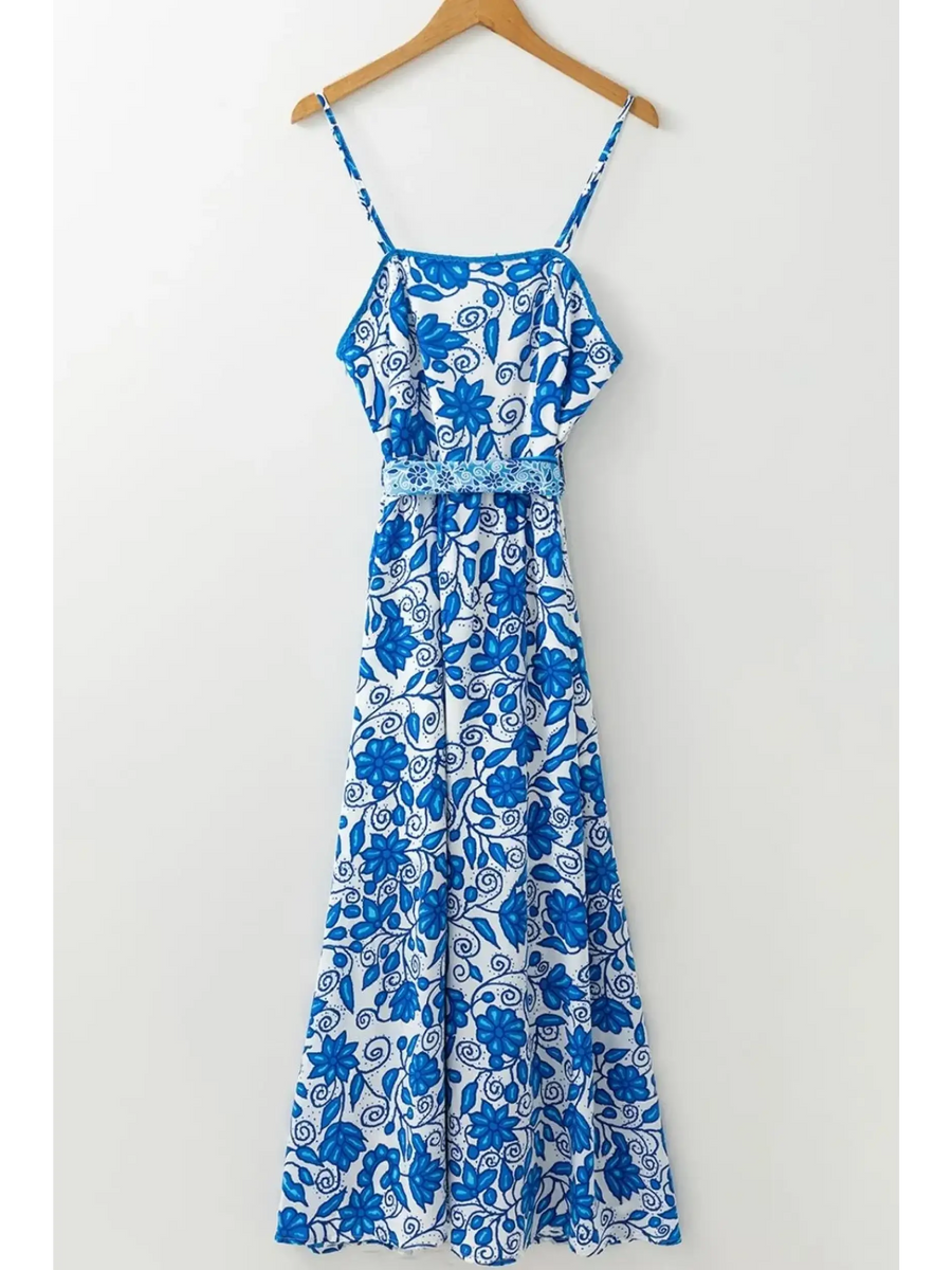 blue floral maxi dress affordable midi dress with spaghetti straps and decorative waist detail image hanging up 