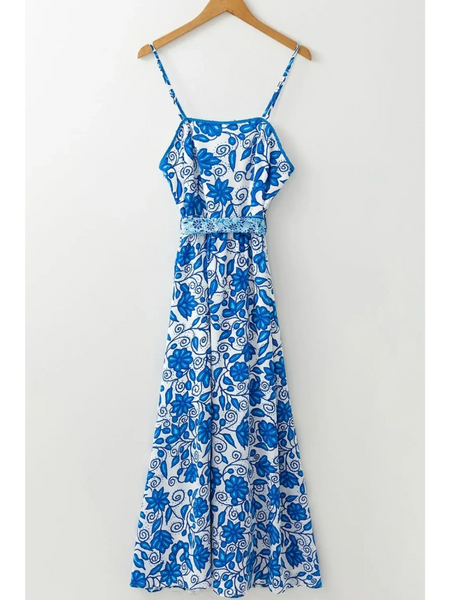 blue floral maxi dress affordable midi dress with spaghetti straps and decorative waist detail image hanging up 