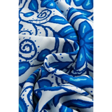 Close-up of fabric with blue floral print pattern for blue floral maxi dress affordable by Trendsi