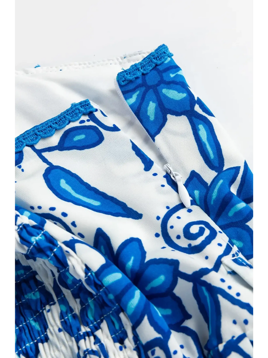 Close-up of blue floral maxi dress affordable by Trendsi showing detailed floral pattern and stitching
