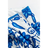 Close-up of blue floral maxi dress affordable by Trendsi showing detailed floral pattern and stitching