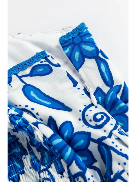 Close-up of blue floral maxi dress affordable by Trendsi showing detailed floral pattern and stitching