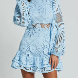 Babe Beachwear light blue lace mini dress with long sleeves and ruffled hem for cocktail events