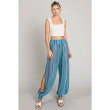 Babe Beachwear blue lightweight open leg beach pants with striped pattern worn with white tank top
