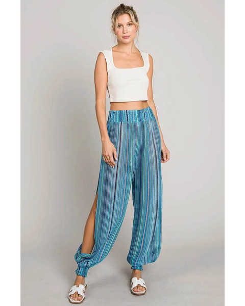 Babe Beachwear blue lightweight open leg beach pants with striped pattern worn with white tank top