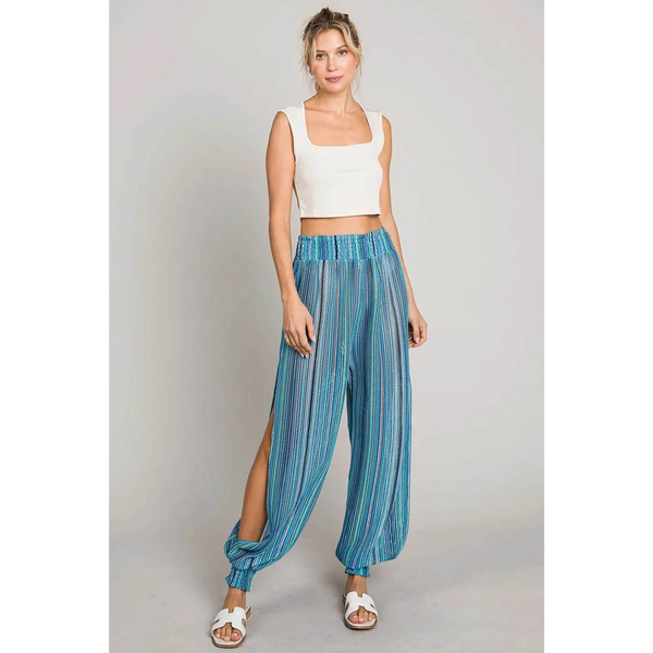 Babe Beachwear blue lightweight open leg beach pants with striped pattern worn with white tank top