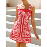 Trendsi pink patterned mini dress with wide straps and floral design on a female model
