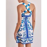Trendsi blue mini dress with white and blue floral pattern and crossed back straps