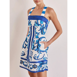 Trendsi blue mini dress with white and blue floral and geometric print featuring thick straps and pockets