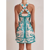 Trendsi blue mini dress with crisscross straps and intricate floral patterns on back