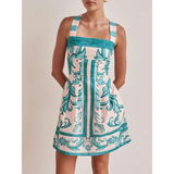 Trendsi blue mini dress with wide straps and intricate floral pattern design