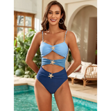 Trendsi blue one piece swimsuit with cutouts and starfish embellishments on a smiling woman by the pool