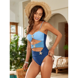 Trendsi blue one piece swimsuit with cutouts and starfish details worn by woman with straw hat