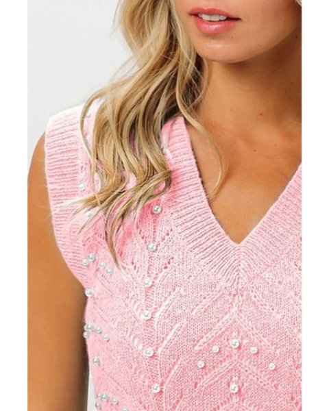 Blush pink sleeveless blouse by Trendsi featuring a V-neck and decorative pearl accents