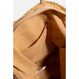Interior view of boho braided tote bag showing tan fabric lining and inner pockets