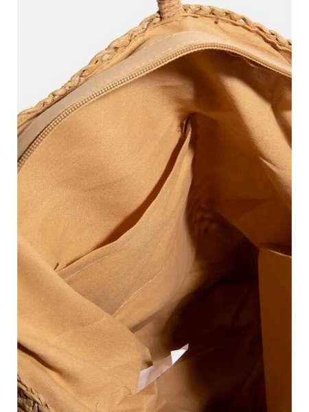 Interior view of boho braided tote bag showing tan fabric lining and inner pockets