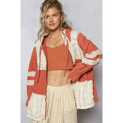 Trendsi boho chic beachwear jacket in rust and cream colors worn over a crop top and skirt