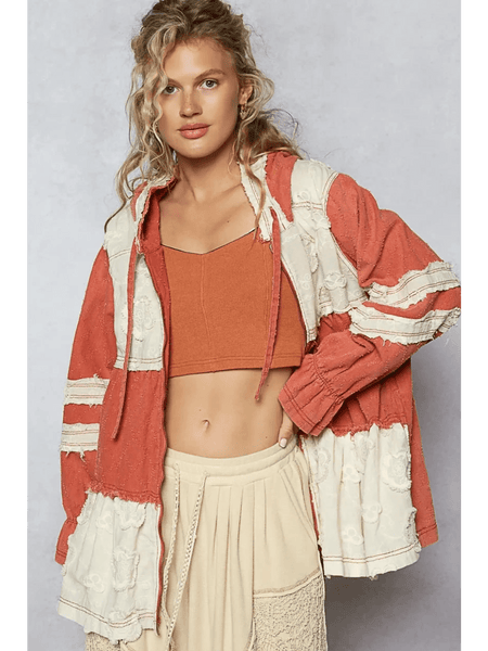 Trendsi boho chic beachwear jacket in rust and cream colors worn over a crop top and skirt