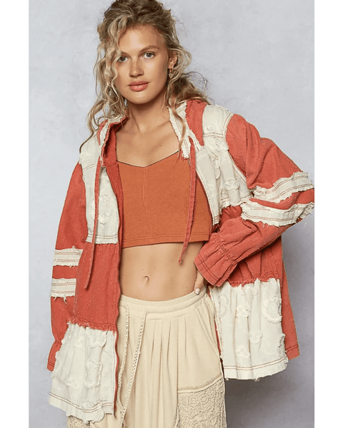 Trendsi boho chic beachwear jacket in rust and cream colors worn over a crop top and skirt