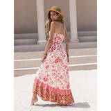 Trendsi crochet boho maxi dress with floral pattern and ruffled hem worn by woman on beach